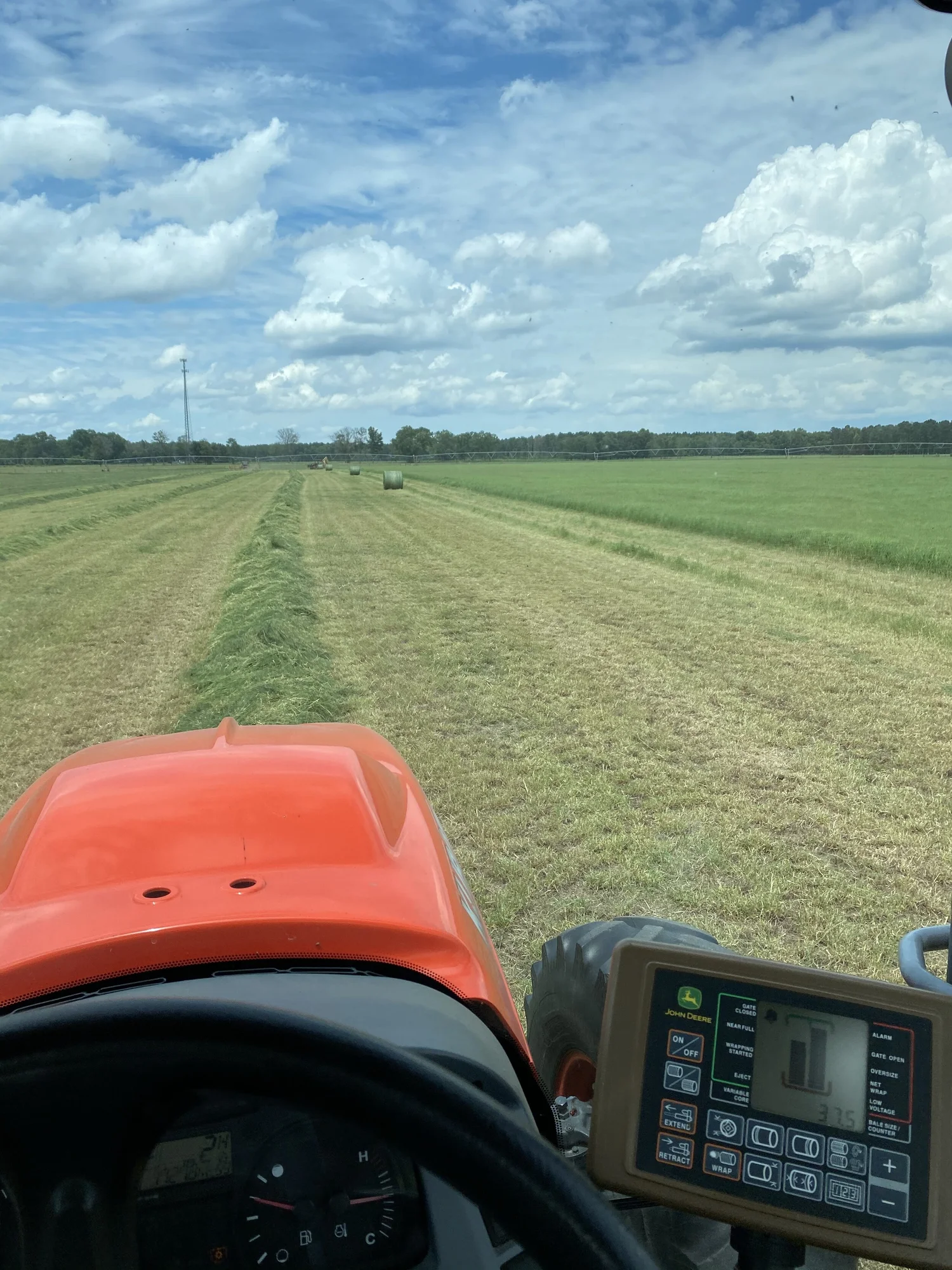 Mowing hay from the tractor seat